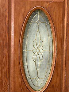 EXTERIOR WOOD DOOR WITH DECORATIVE OBLONG GLASS CENTER (36x80 WAS A DISPLAY-NO KNOB HOLE)