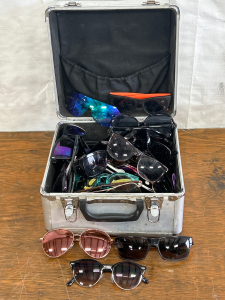 METAL CASE FULL OF MENS AND WOMENS SUNGLASSES
