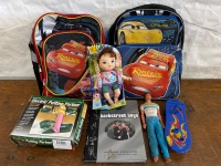 2 LIGHTNING MCQUEEN BACKPACKS, VINTAGE KEN DOLL, BACKSTREET BOYS BOOK, ELECTRIC PUTTING PARTNER, TOY SKATEBOARD AND BABY DOLL