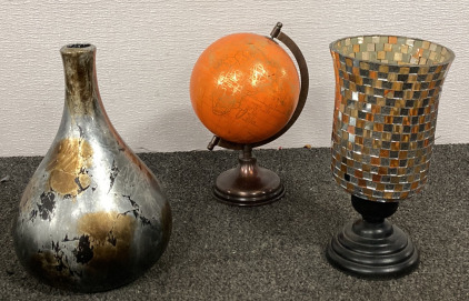 (1) GLASS CANDLE HOLDER, (1) METALLIC VASE, (1) ORANGE WORKD GLOBE