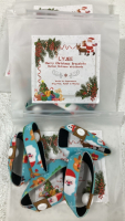 (3) 6 pc Plaid Christmas Decorations; (4) Santa Building Block Sets; (6) Snowman Ornaments; Glittery Gold and Rose Gold Poinsettias; Assorted Santa Hats; Gift Boxes; Card Kits; Stockings Hangers; Velvet Ribbon and More! - 10