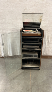 GLASS/ WOOD ROLLING SHELF W/ SONG RECORD PLAYER, VIDEO RECORDER, SONY RECEIVER, AND MORE