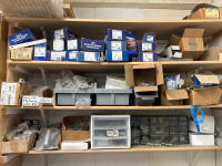 LARGE LOT WITH BOXES ANS BINS OF HARDWARE FOR DOORS INCLUDING HINGES, LATCHES, HANDLES, 2 WINDOW PANES WITH INTERNAL BLINDS ANS 1 SMALL/NARROW PANE (SHELVING NOT INCLUDED) - 2