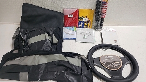 Large lot of flags (5) Table clothes (1) Steering wheel cover (1) Passenger or driver seat cover (1) Rear passenger seat cover