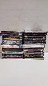 (33) Assorted movies including "The office" "300" "8 mile"