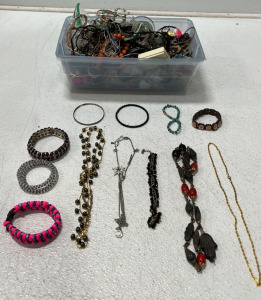 Small Tub Of Assorted Jewelry Including Bracelets, Necklaces And Earings