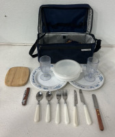 (2) Silverware Sets With Plastic Handles, (2) Plastic Decorative Plates, (1) Plastic Tupperware Bowl With Lid, (2) Plastic Wine Glasses, (1) Picnic Bag And More