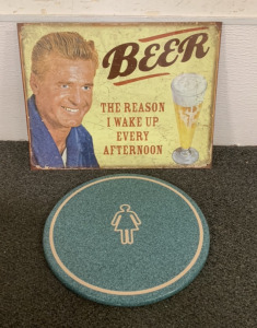 (1) &ldquo;BEER THE REASON&rdquo; METAL SIGN, AND (1) CERMIC WOMENS BATHROOM SIGN