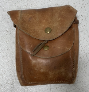 (1) SMALL VINTAGE SATCHEL WITH TUBING