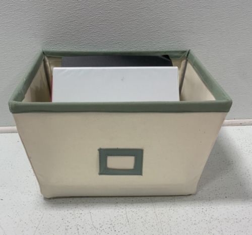 (1) FABRIC BIN FILLED WITH (8) BINDERS