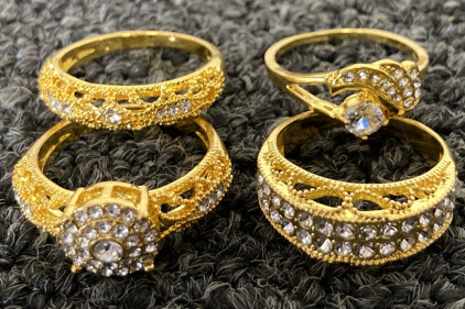 GOLD TONED RINGS WITH FACETED CLEAR STONES SIZES 10 & 9