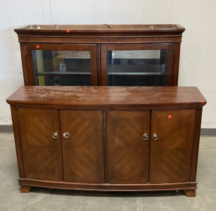 (1) LARGE DARK WOOD CABINET SET, WITH (1) 4 DOOR CABINET BASE, AND (1) 2 DOOR GLASS CABINET TOPPER