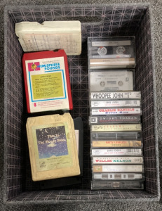 BOX OF CASSETTES INCLUDING WILLIE NELSON, PATTY LOVELESS, DWIGHT YOAKAM, CHARLIE DANIELS, JERRY REED, THE MARSHALL TUCKER BAND AND MORE