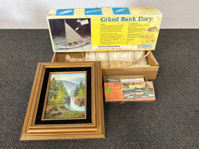 FRAMED OIL PAINTING BY KATHY DICKINSON (13”x11”), WOOD DISPLAY MODEL BANK DORY, AND SILVER STREAK HO SCALE MODEL KIT