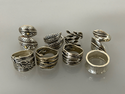 8 SILVER TONE RINGS (SIZES 7,8,9)