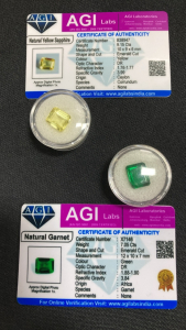 (2) Certified Natural Gemstones: (1) 9.15ct Yellow Sapphire, (1) 7.05ct Green Garnet