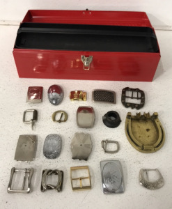 (19+) Belt Buckles Of Different Sizes, (1) Small Red Tool Box With Handle Shelf