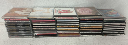 (50+) CDs Including Honkey Ton Angels, Broadway Musicals, The Very Best Of Kenny Roger’s, The Best Of Mozart, Disney Superstar Hits And More