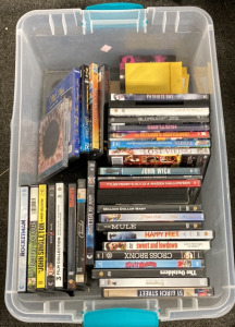 BIN OF MOVIES INCLUDING JOHN WICK, HAPPY FEET, MADLY MADAGASCAR, 15 BIRCH STREET, SHATTERED DREAMS, SHUTTER ISLAND, ROCKETMAN AND MORE