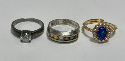 (1) Clear Gemstone .925 Silver Ladies Ring Size 6, (1) Multicolored Gemstone .925 Silver Ladies Ring Size 6, (1) Adjustable Gold Toned / Blue Center Stone