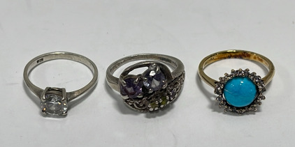(1) Clear Gemstone .925 Silver Ladies Ring Size 5-3/4, (1) Multicolored Gemstone .925 Silver Ladies Ring Size 6, (1) Gold Toned / Blue Center Stone Ladies Ring Size 6