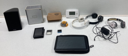 (3) Assorted Headphones (2) Assorted I Pods (1) SigSauer Red Dot Sight and More!
