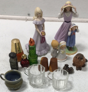 (5) Avon Perfume Bottles (1) Set of Wood Salt & Pepper Shakers (3) Ceramic Decor (1) Bird Figurine (1) Beaver Figurine (2) glass cups (1) Ceramic Vase