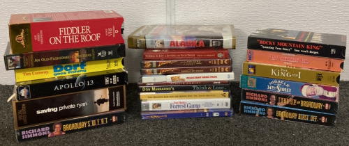 22 VHS TAPES AND DVDS INCLUDING INDIANA JONES, FIDDLER ON THE ROOF, APOLLO 13, SAVING PRIVATE RYAN, ALASKA, THE KING AND I AND MORE