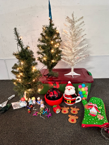 2 SMALL LIGHT UP CHRISTMAS TREES (BOTH WORK), SMALL WHITE TREE, SMALL ORNAMENTS, PEANUTS THEMED ROTATING-COLOR CHANGING LIGHT (WORKS), SANTA IN A MUG AND A OVEN MITT WITH COOKIE CUTTER