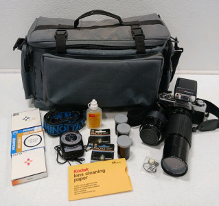 (1) Minolta XG1 35mm Camera (1) ACCESS 55mm Skylight 1A Lens (1) Minolta Lens & More