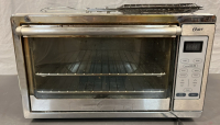 OSTER TOSTER OVEN ( POWERS ON ) 12”x 22”x 16 1/2”