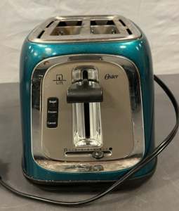 OSTER TEAL TOASTER ( POWERS ON)