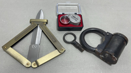 (1) Hand Made Steel Spring Type Lock, (1) Scissor Action German Inscribed Paratrooper Knife, (1) 10x By 21mm Jewelers Loupe In Carrying Case