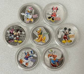 (7) COLLECTIBLE MICKEY AND FRIENDS COIN/TOKENS