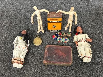 VINTAGE WATKINS METAL NUTMEG CAN, VINTAGE LEATHER WALLET WITH HORSE PRINT, VINTAGE CLIP-ON EARRINGS, 2 VINTAGE SMALL NATIVE AMERICAN DOLLS (1 MISSING AN ARM), BRASS TONE LOCKET ORNAMENT AND 2 SMALL WOODEN FIGURES