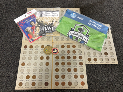 COLLECTIBLE PENNIES, (2) MILITARY COLLECTOR COINS, DAVE NIEHAUS MEMORIAL PATCH, E.T. NECKLACE AND SEATTLE SOUNDSRS FC BANNER