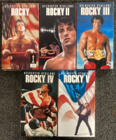 DVDS AND VHS TAPES INCLUDING ROCKY VHS COMPLETE SET, INDIANA JONS CHAPTERS 23, 24, AND 25, WEDDING CRASHERS, LIFE, WILL PENNY, OUTLAW JUSTICE, GRACE UNDER FIRE AND MORE - 2