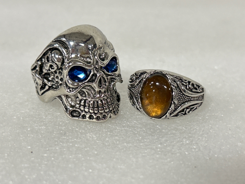 SILVER TONED RING WITH TIGERS EYE STONE AND SKULL RING WITH JEWELED EYES SIZES 12-1/2 AND 13