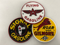 THREE 4-1/2” CAST IRON GASOLINE GARAGE MARKERS