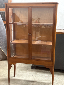 GLASS CABINET WITH WOOD FRAME-HAS SCRACK IN A SMALL AREA OF GLASS (61”x35”x15”)