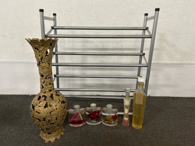 CAST IRON VASE, EXTENDABLE SHOE RACK AND BOTTLES OF BATH OIL