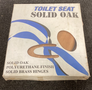 (1) SOLID OAK TOILET SEAT WITH POLYURETHANE FINISH AND SOLID BRASS HINGES