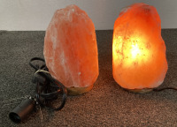 (2) HIMALAYAN PINK SALT LAMPS. (1) WORKS AND (1) NEEDS A BULB