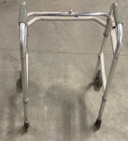 (1) INVACARE CORPORATION METAL WALKER WITH (2) FRONT WHEELS