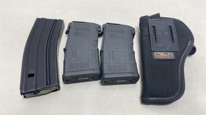 (2) PMAG 5.56 x 45 Magazines, (1) Windham Weoponry 5.56 Magazine (1) Uncle Mikes Sidekick Pistol Holster,