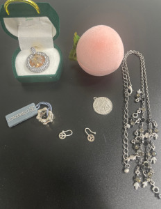 (1) 3/4&rdquo; .925 Necklace Pendant (1) &ldquo;Finally 20&rdquo; Necklace Pendant W/Box (1) Charm Necklace (1) .925 Neclace Pendant (1) Pair of Peace Sign Earrings