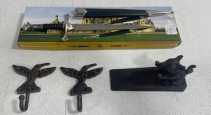 (1) 7 1/2&rdquo; Blade Sword (2) Hummingbird Coat Hangers (1) Mouse Cast Iron Door Stopper