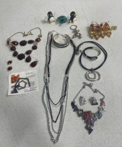 (4) Beautiful Necklaces (2)Beautiful Bracelets (2) Beautiful Pairs of Earrings (1) Keychain (3) Bobble Head Decorations (2) Sets of Decoration Slippers