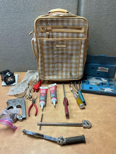 SMALL SUITCASE VARIOUS TOOLS INCLUDING 12” BASIN WRENCH WITH SPRING LOADED JAW, HARLEY DAVIDSON GEAR SHIFT LEVER PEDAL, PROJECTOR BULB AND VARIOUS OTHER ITEMS