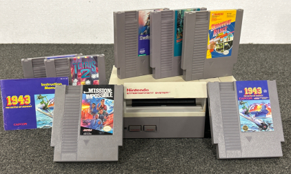 VINTAGE NINTENDO GAME CONSOLE WITH 7 GAMES INCLUDES: TETRIS, MISSION IMPOSSIBLE, 1943 BATTLE OF MIDWAY, DEADLY TOWERS AND MORE. HAS NO POWER SOURCE UNABLE TO TEST.